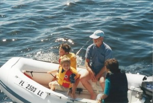 dad and boys on boat